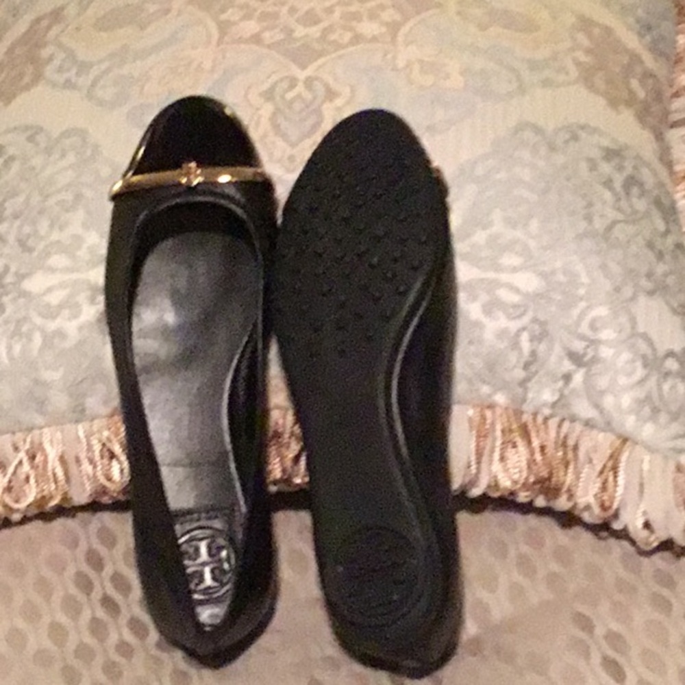 Tory Burch worn once paten and black shoe.